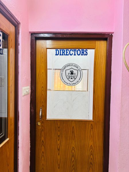 The door to the Directors' office, carrying the Steadyshield Legal LLP seal.