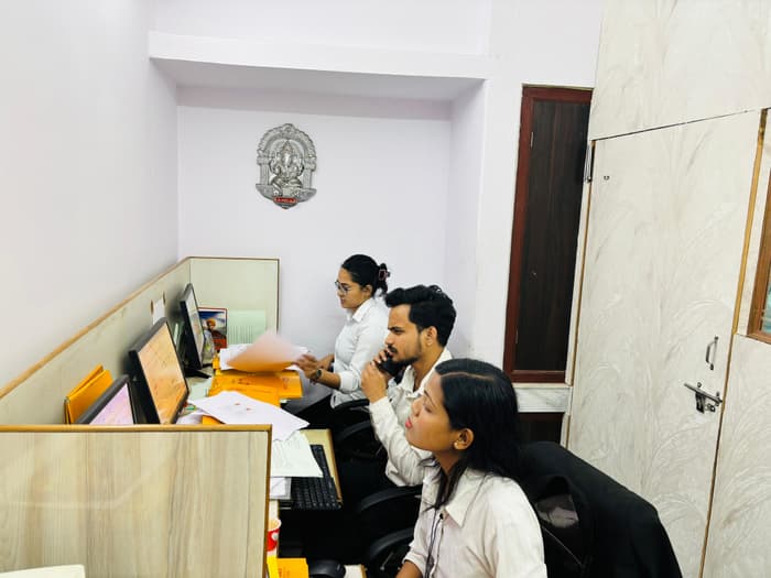 Members of the team working through matter files at their desks.